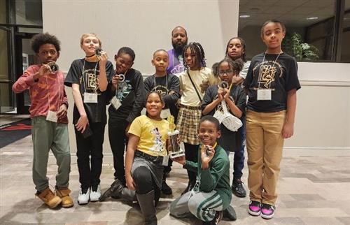  group of students showing their medals won at a competition 